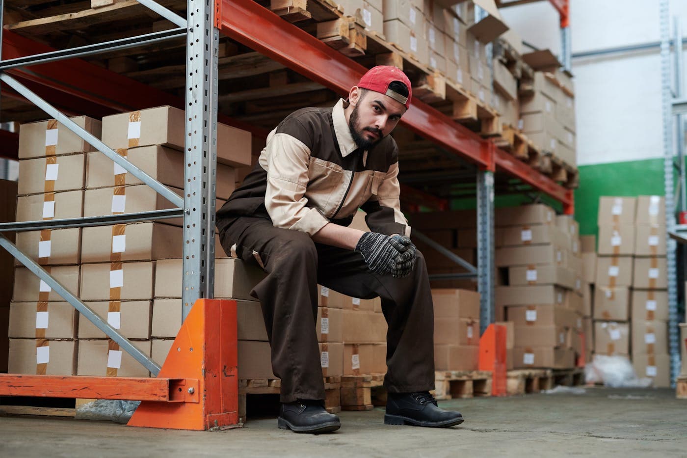 Warehouse team member among stocked racking